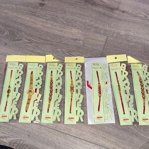 Set of Rakhi Bracelets with Red and Gold Accents (7 pack) thread bracelets